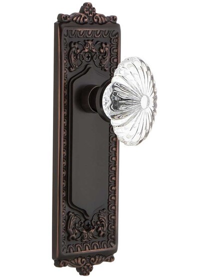 Egg and Dart Style Door Set with Oval Fluted Crystal Glass Knobs in Timeless Bronze.